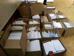 Clasificación y distribución de folletos a domicilio.